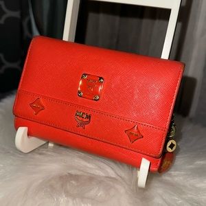 MCM Orange, Coral Colored Trifold Medium Studded Motif Logo with Charms,…